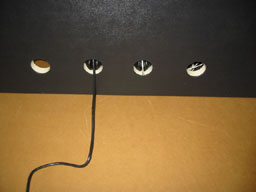 200Heatercord goes out through one of the bottom two center holes in back.